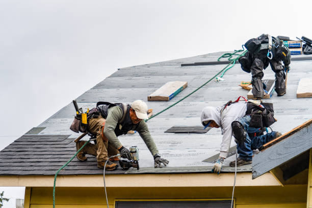 Professional Roofing technician working in South Burlington, VT